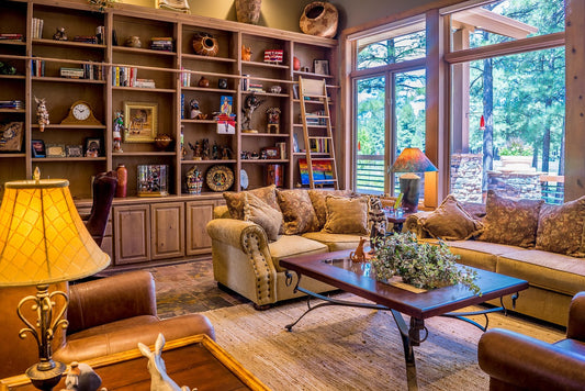 Warm and inviting living room with rustic wooden shelves, plush sofas, and natural light—perfect home décor inspiration for UK interiors.