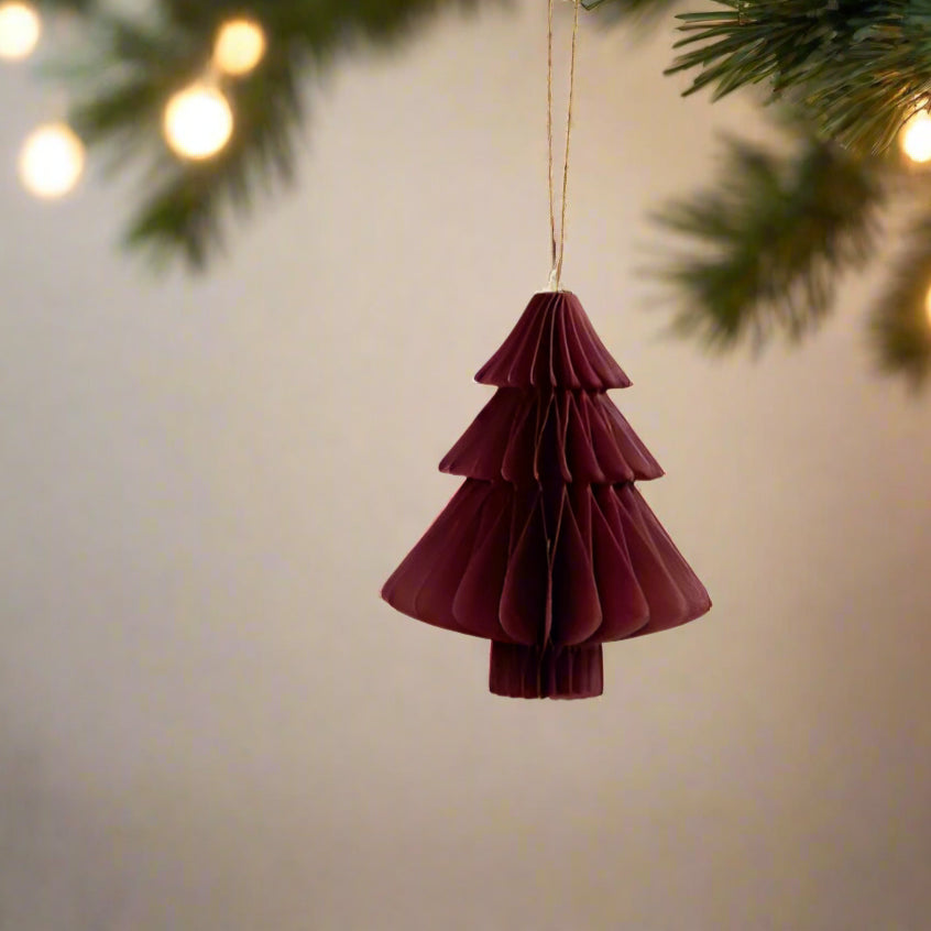 Rich claret coloured paper festive hanging decoration in a tree shape hanging from a Christmas Tree. Set of 3, lightweight, vibrant and affordable - shop at Purple Flamingo UK