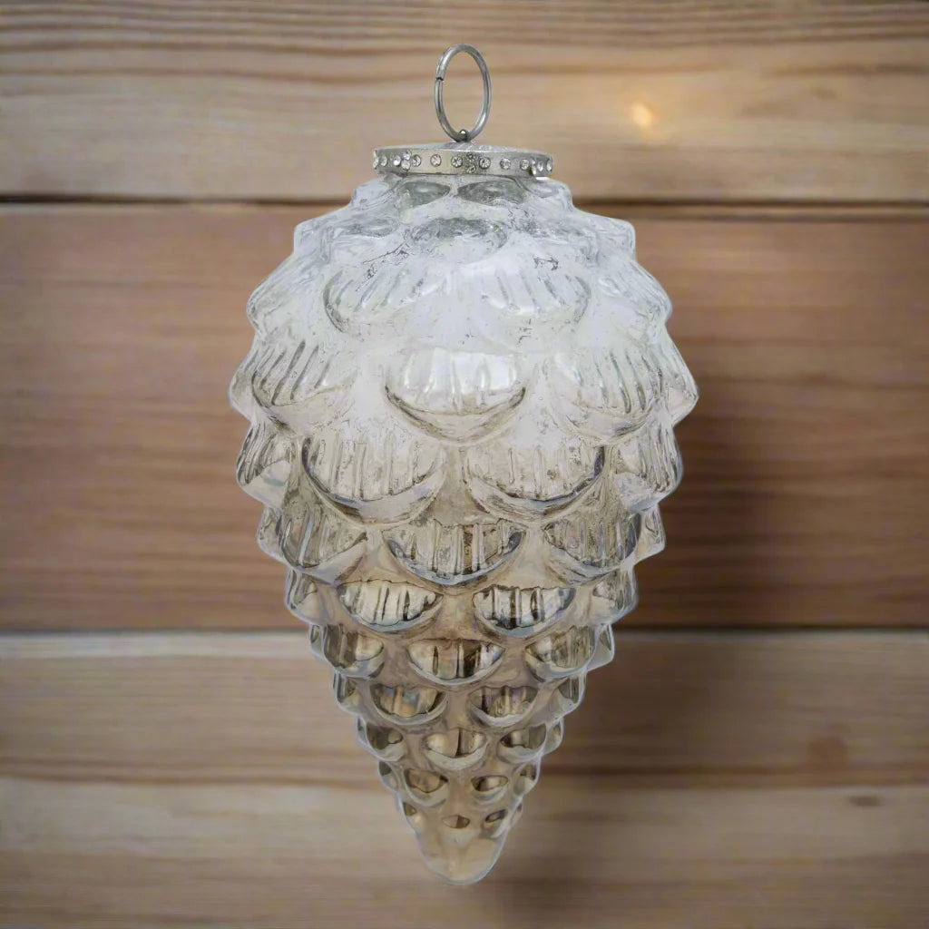 Coffee Ombre Decorative glass pine cone hanging christmas ornament on a natural wood background