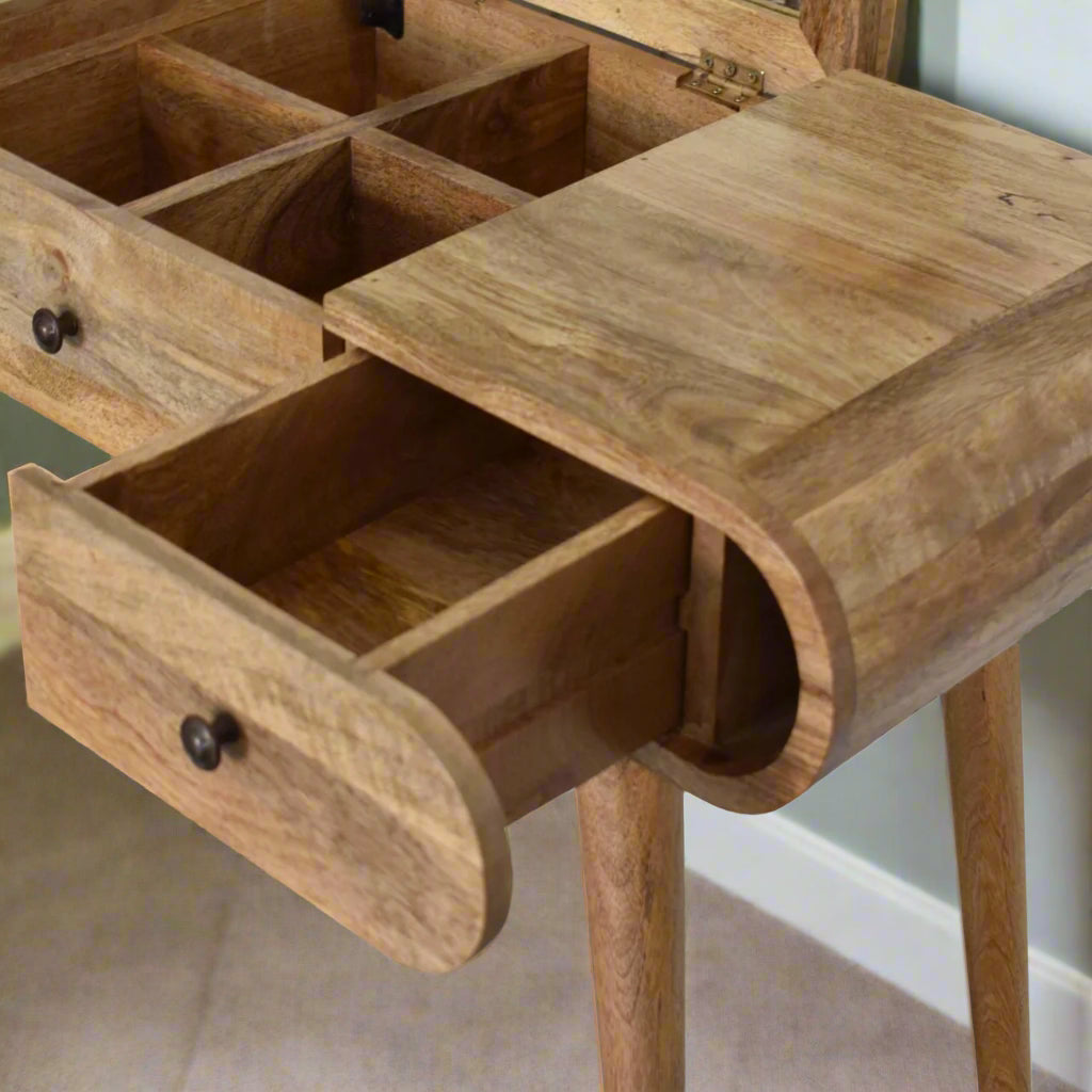 rounded dressing table, with oak-ish finish, showcasing close up of open right drawer and open mirror, revealing compartment storage
