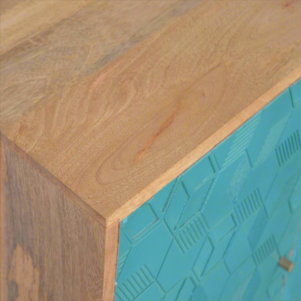 Top-down view of the top right edge of the Acadia Teal Cupboard, showing the wooden surface, wooden side, and teal front panel.