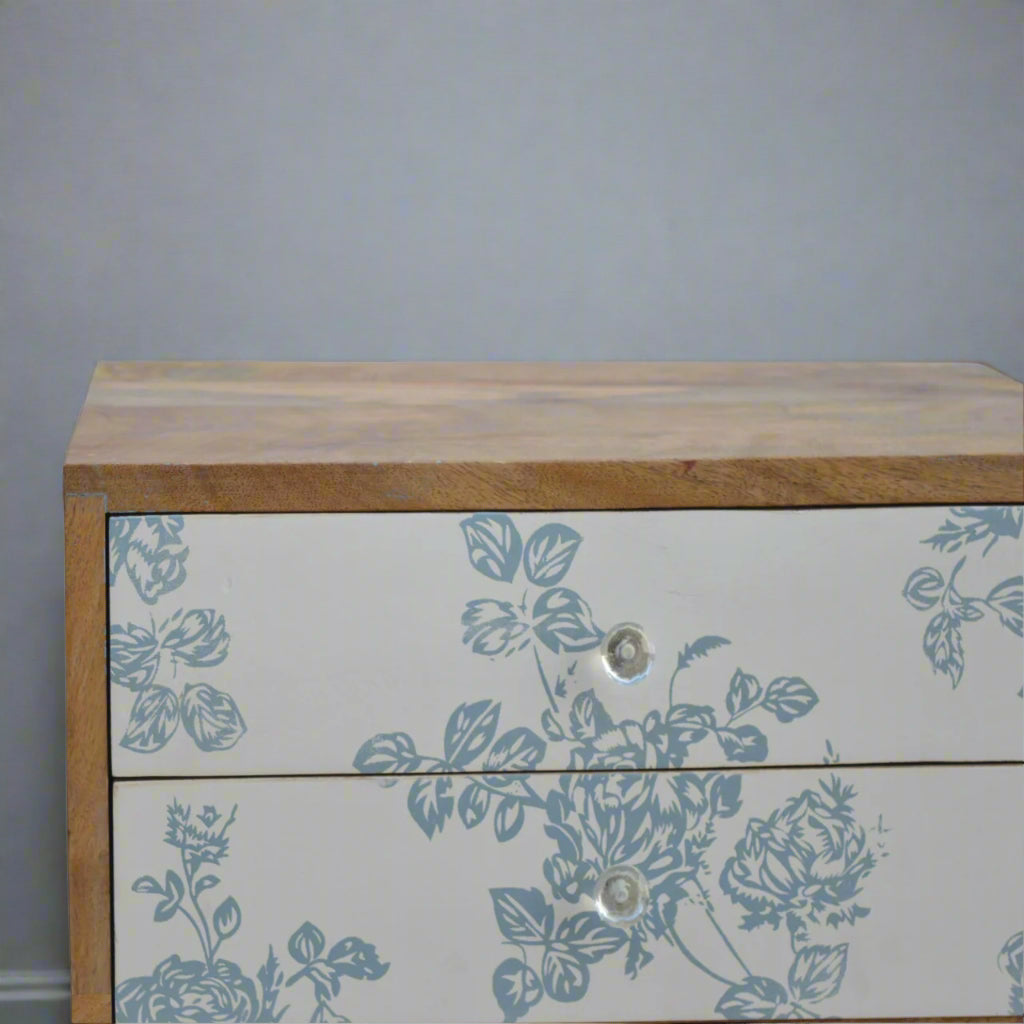Close-up focus on the top left edge of the Blue Floral Screen Print Bedside Table, showing the oak-ish finish and craftsmanship.