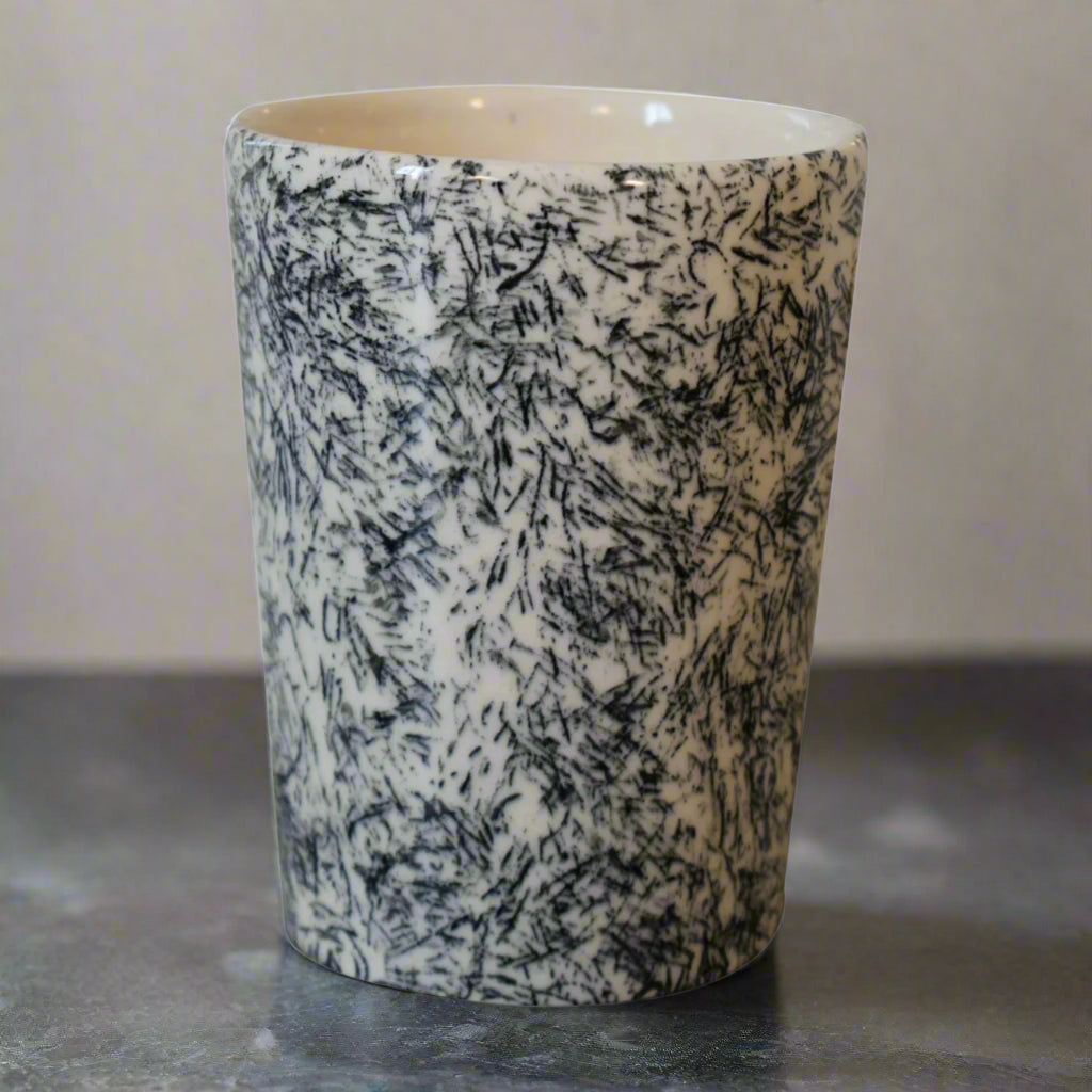 Detailed image of the Daphne toothbrush holder showcasing handcrafted porcelain texture and subtle grey pattern.