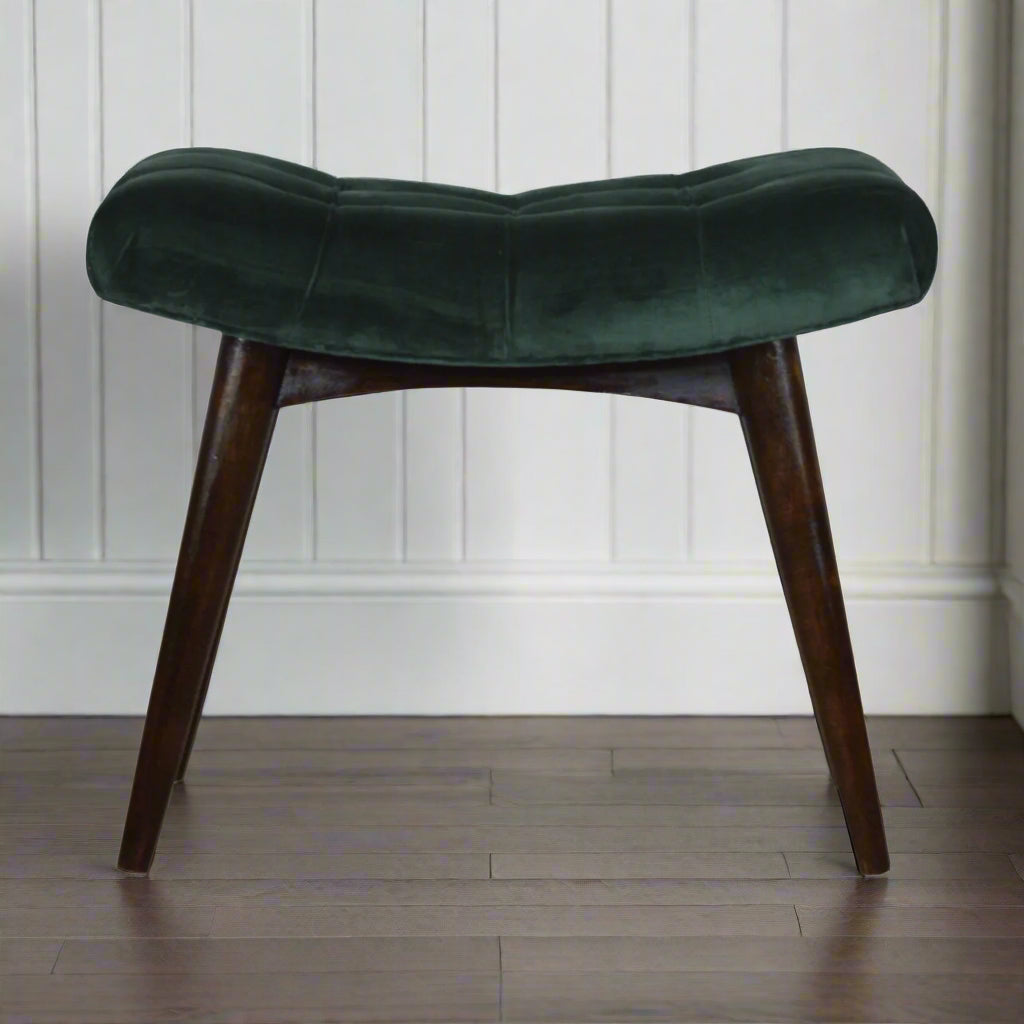 Front view of emerald velvet curve stool with walnut‑finish legs