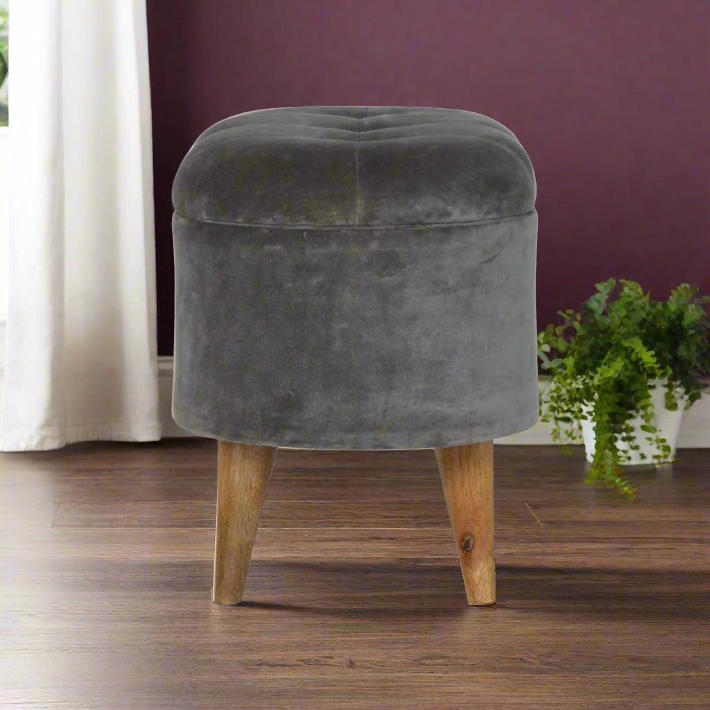 Side view of the Grey Velvet Storage Footstool, illustrating its compact size and elegant silhouette.