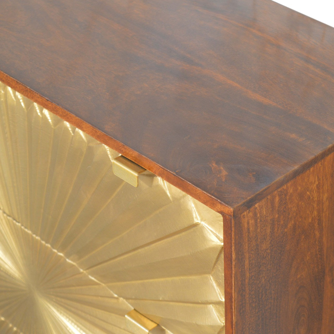 Top‑down shot showing wood grain and brass drawer fronts