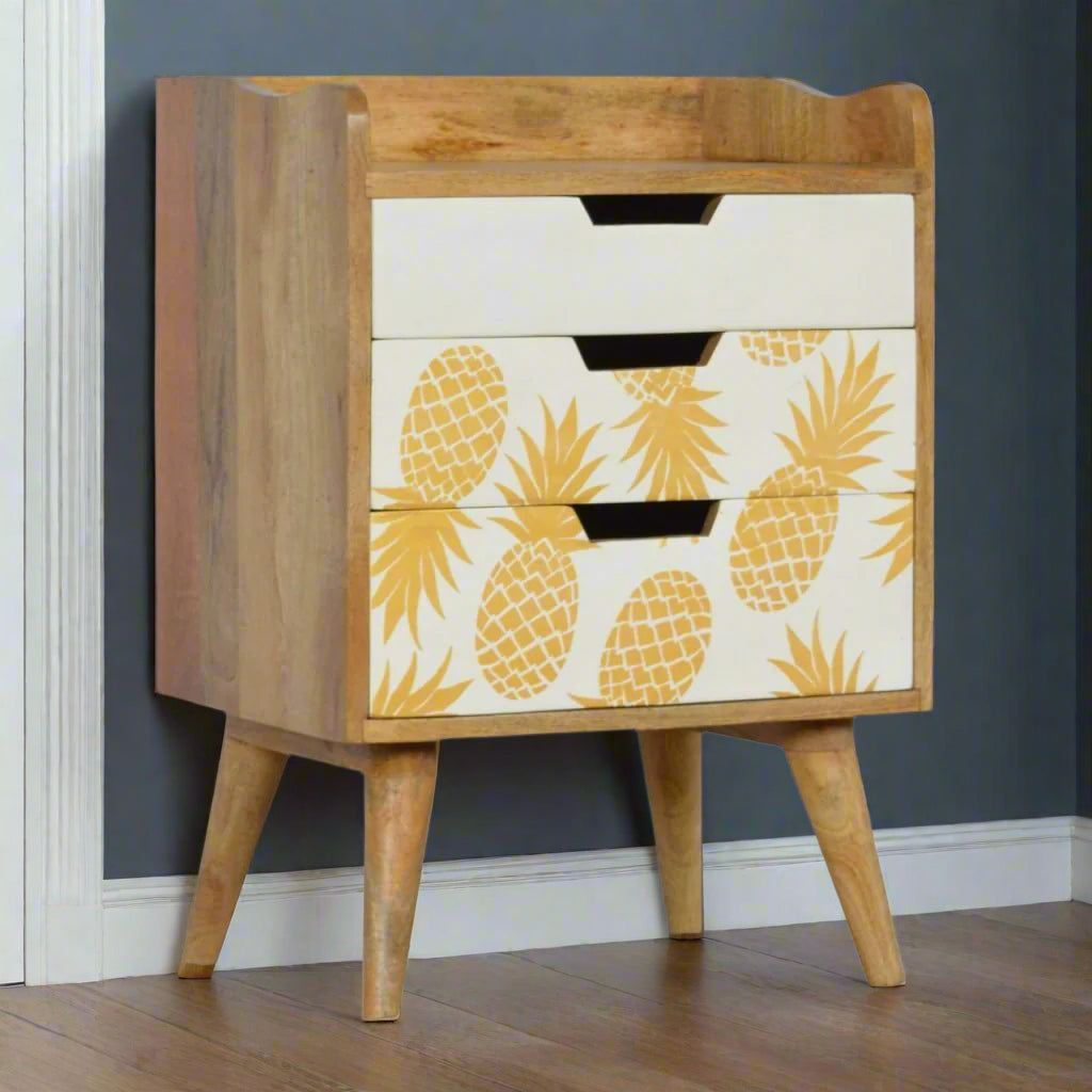 Full front angled view of the Pineapple Screen Print 3 Drawer Bedside Table, showcasing its unique design, oak-ish finish, and Nordic style legs.