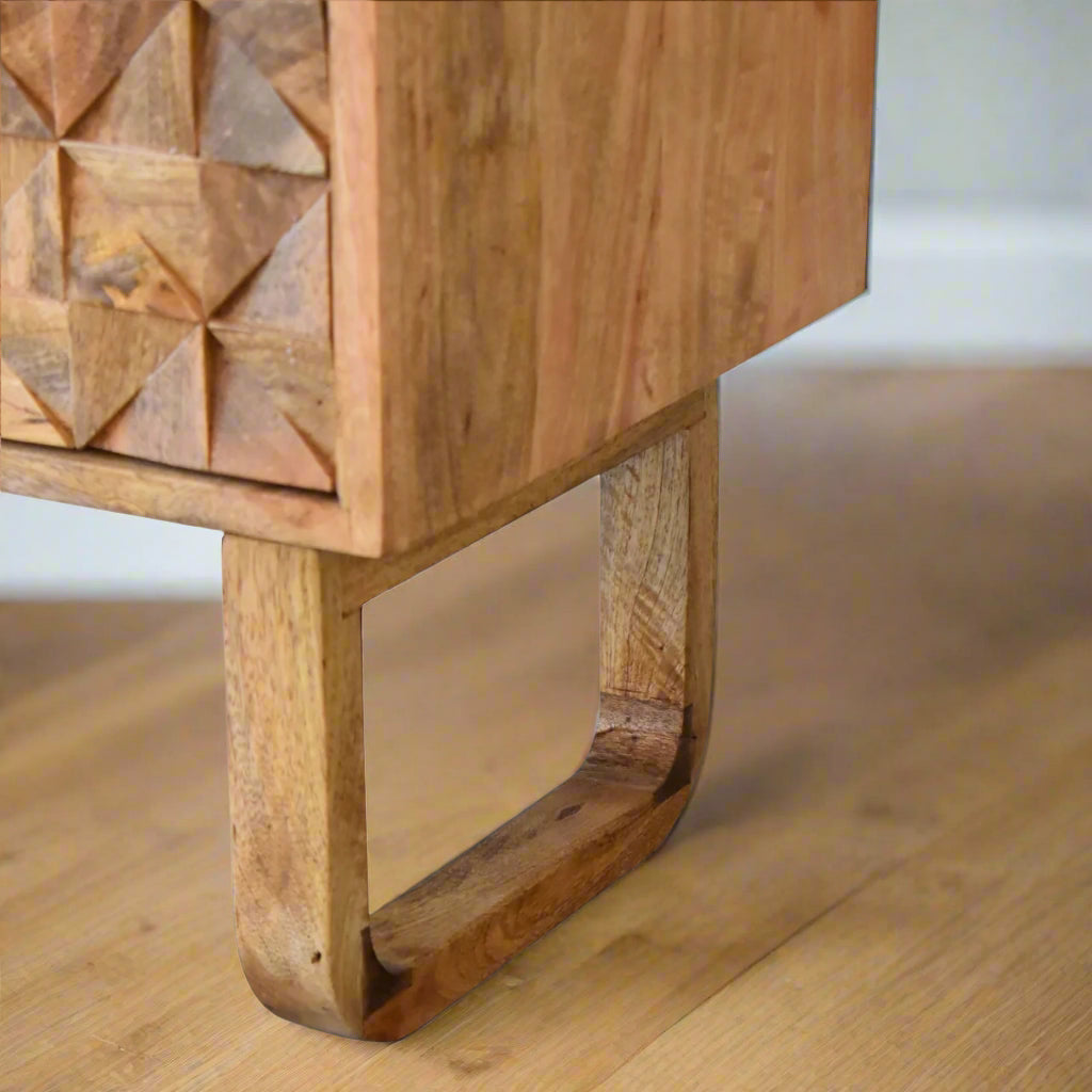 Detailed close-up of the bench’s solid mango wood leg with oak-ish finish.