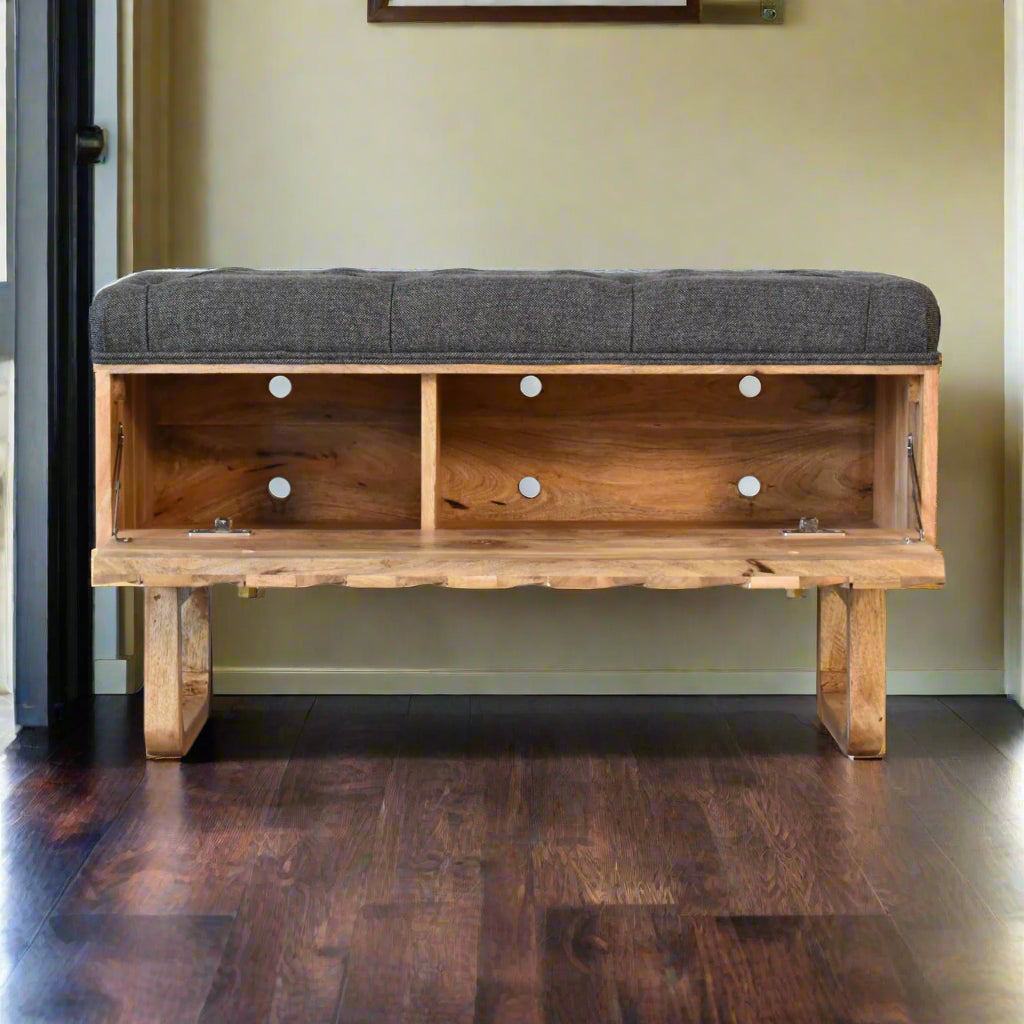 Storage compartment inside mango wood bench with upholstered top lifted.