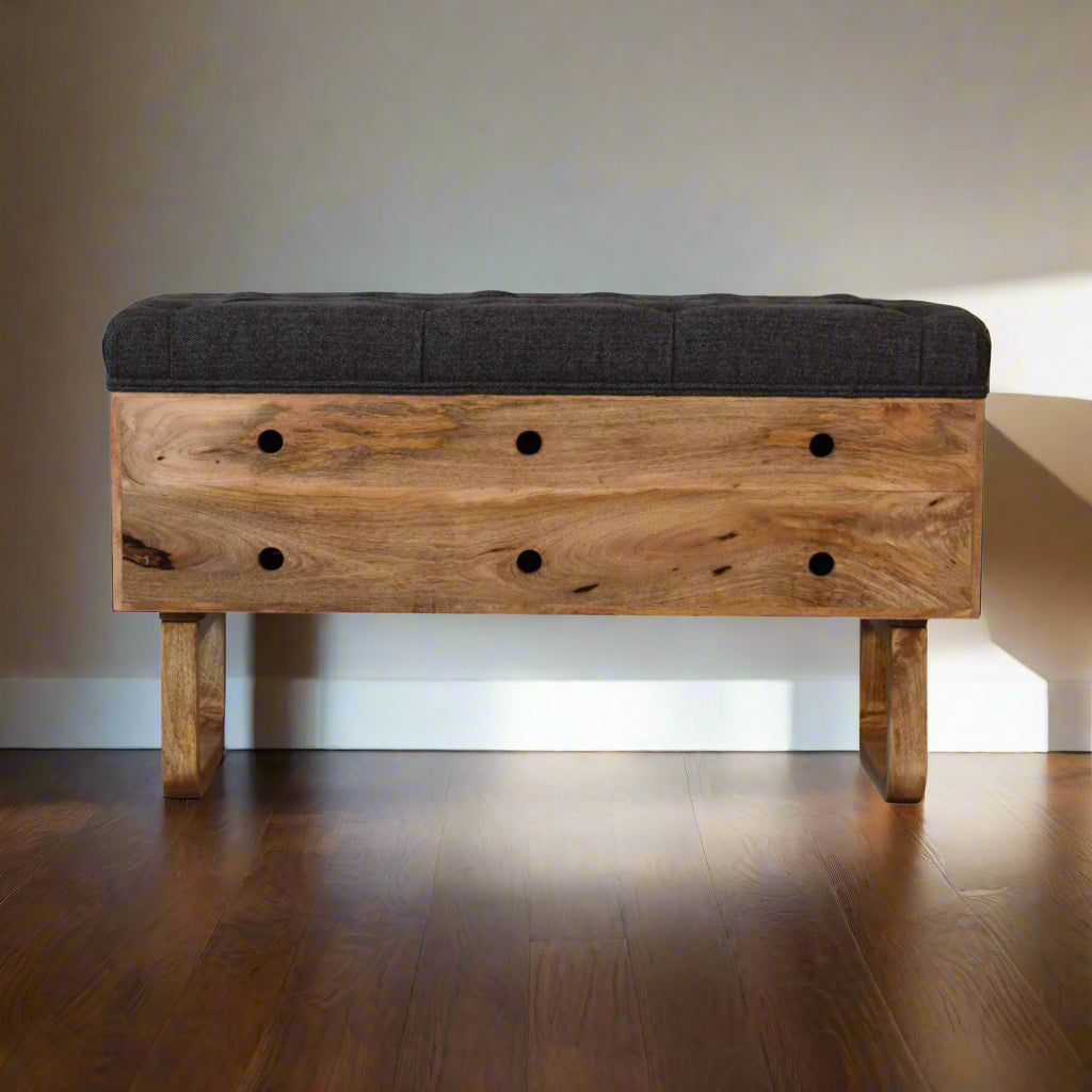 Pineapple carved storage bench placed against a wall.