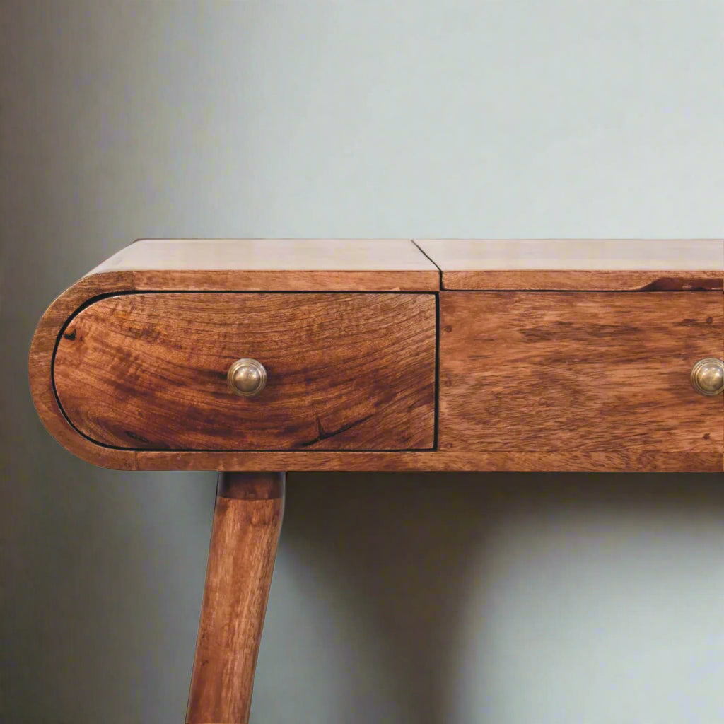 rounded dressing table with honey caramel finish, showing close up frontal view of left drawer.
