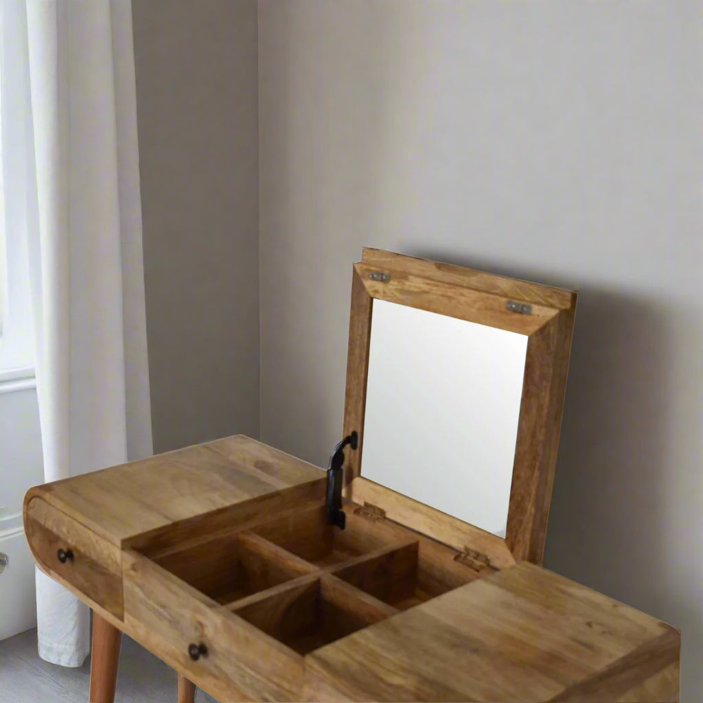 Close angle view of the rounded dressing table, with oak-ish finish, showcasing the fold-up mirror open, revealing storage compartments.