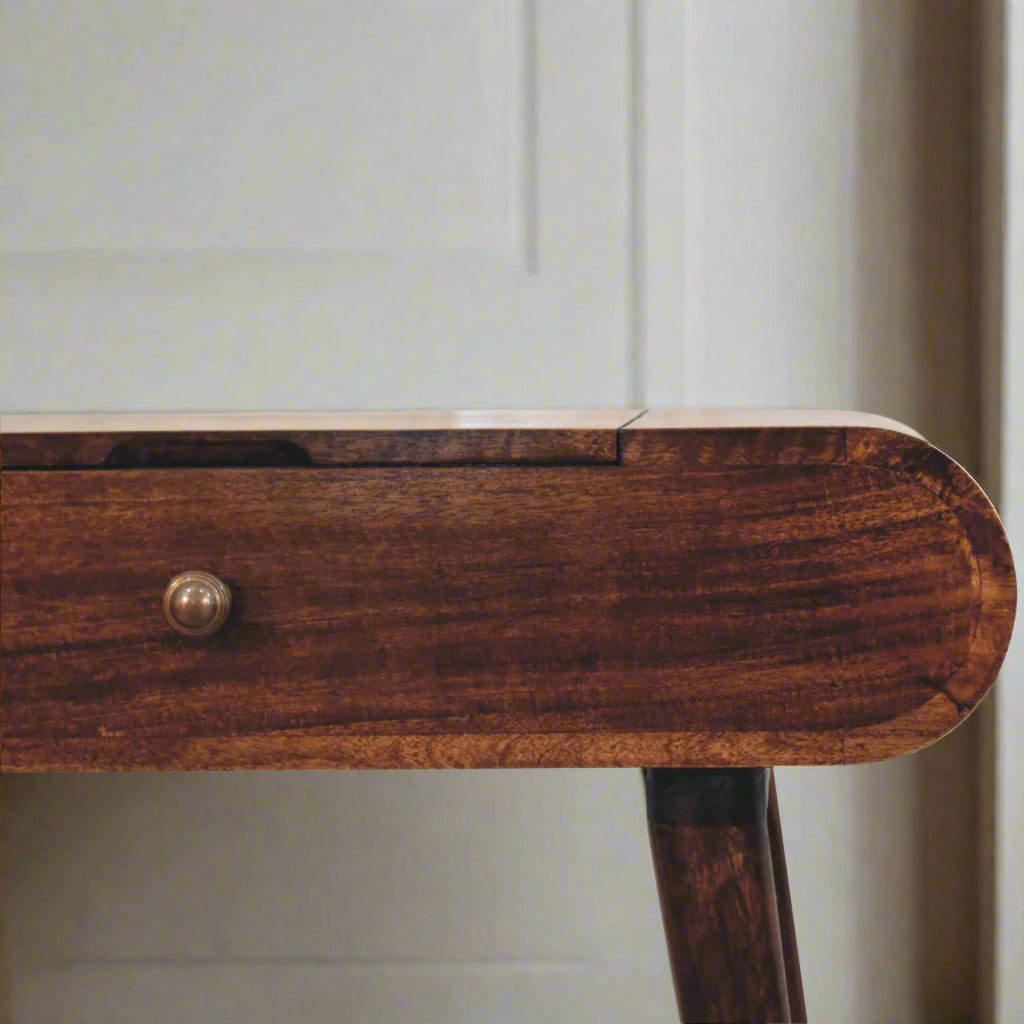 rounded mini dressing table with california walnut finish, showing close up frontal view of right half and drawer handle