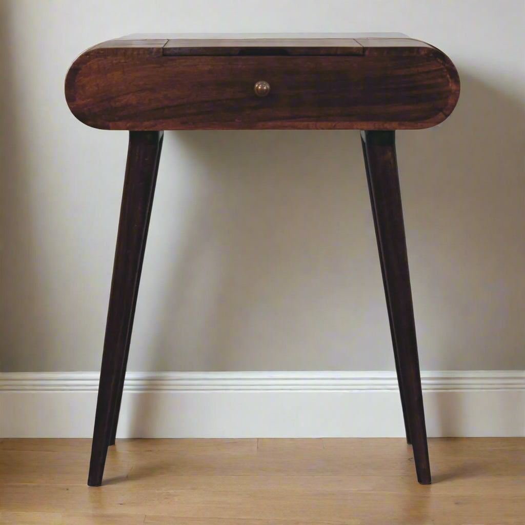 rounded mini dressing table with california walnut finish, showing close up frontal view and nordic style legs