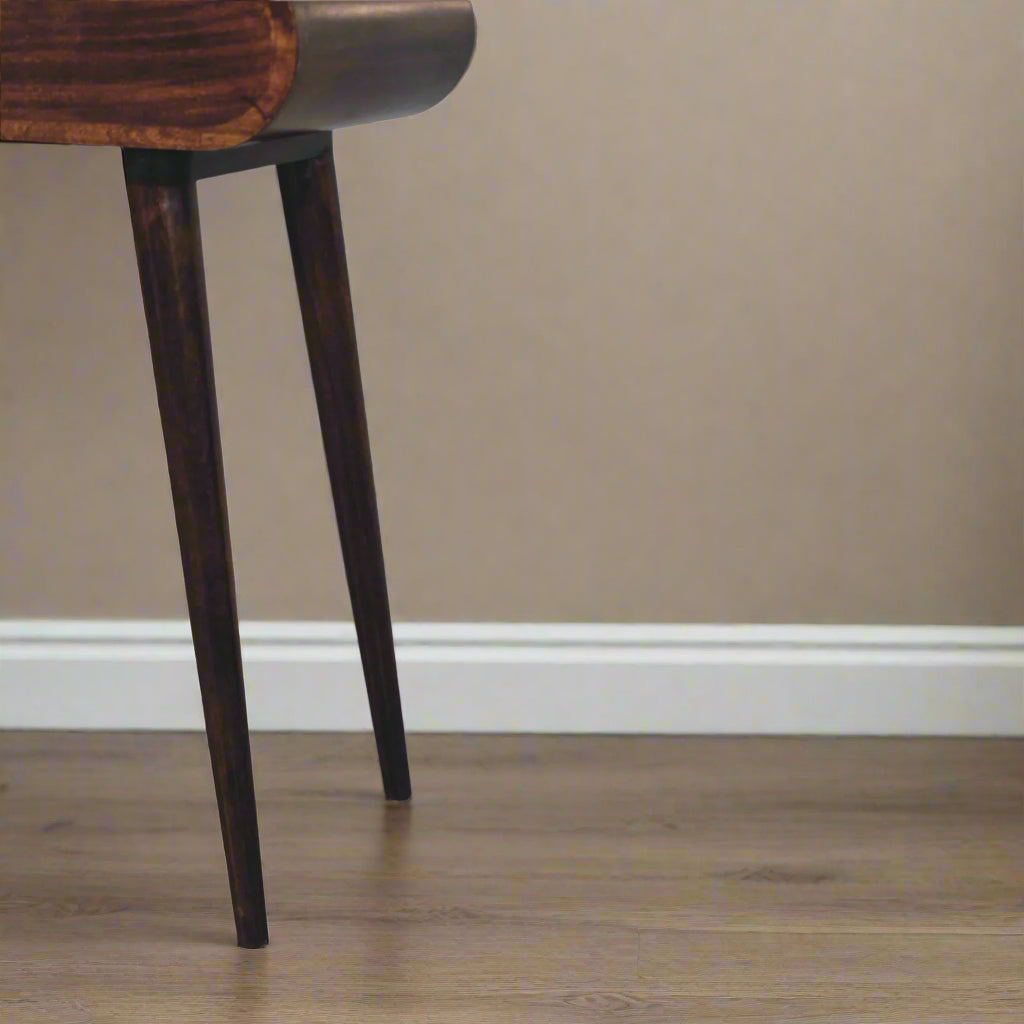 Rounded mini dressing table with california walnut finish, showing close up of the right side nordic style legs.
