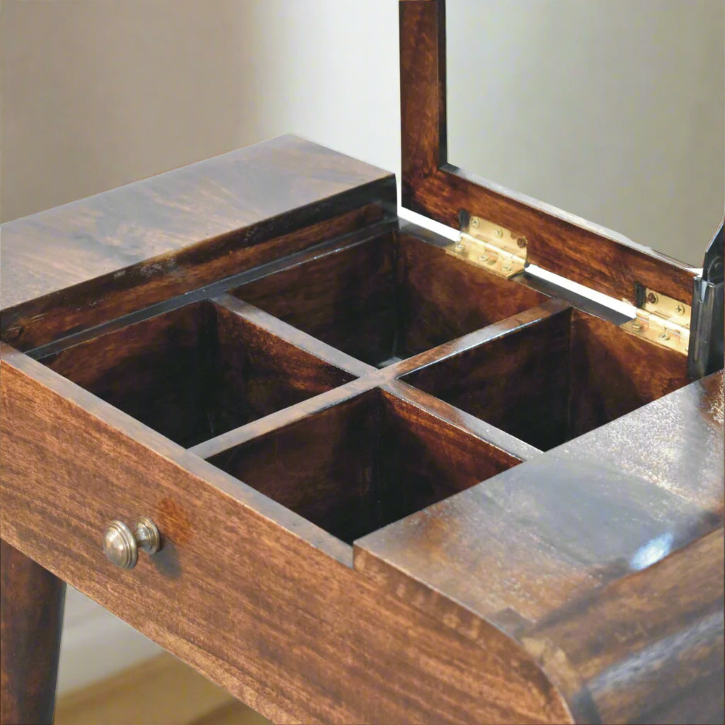 Rounded mini dressing table with california walnut finish, showing close up frontal view of open fold-up mirror, revealing hidden storage compartments.
