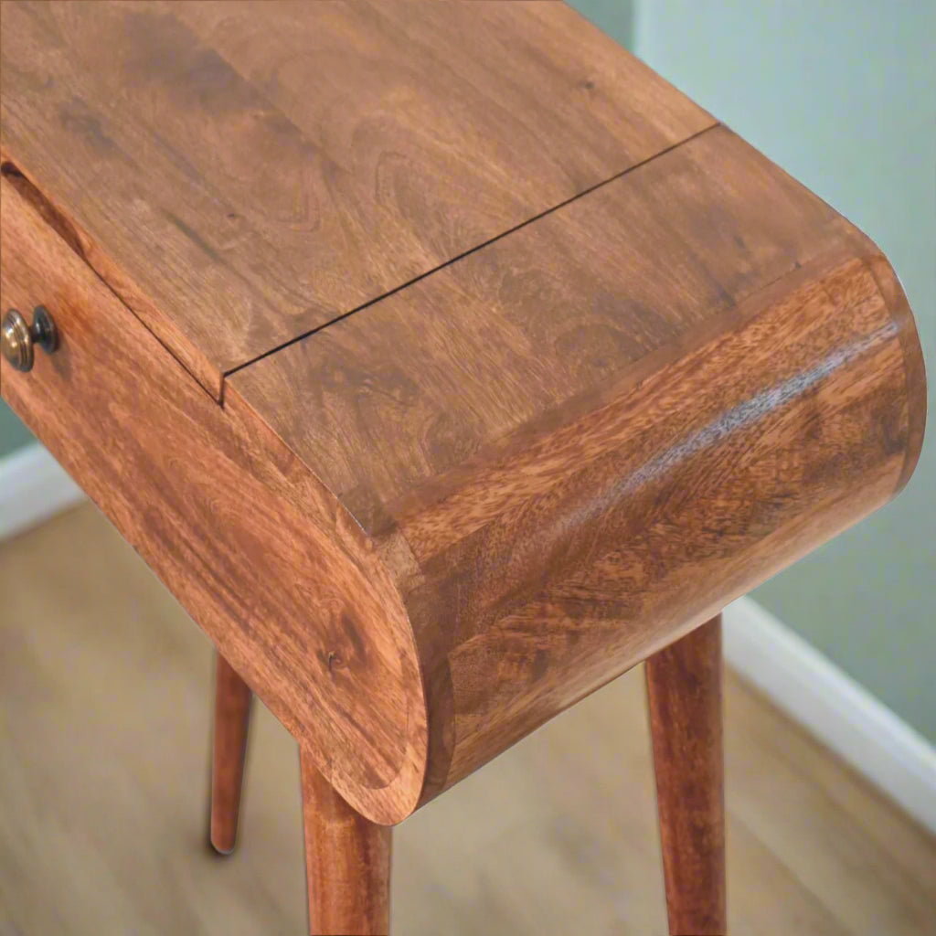 Rounded mini dressing table with honey caramel finish, showcasing the rounded curve top right corner and closed mirror