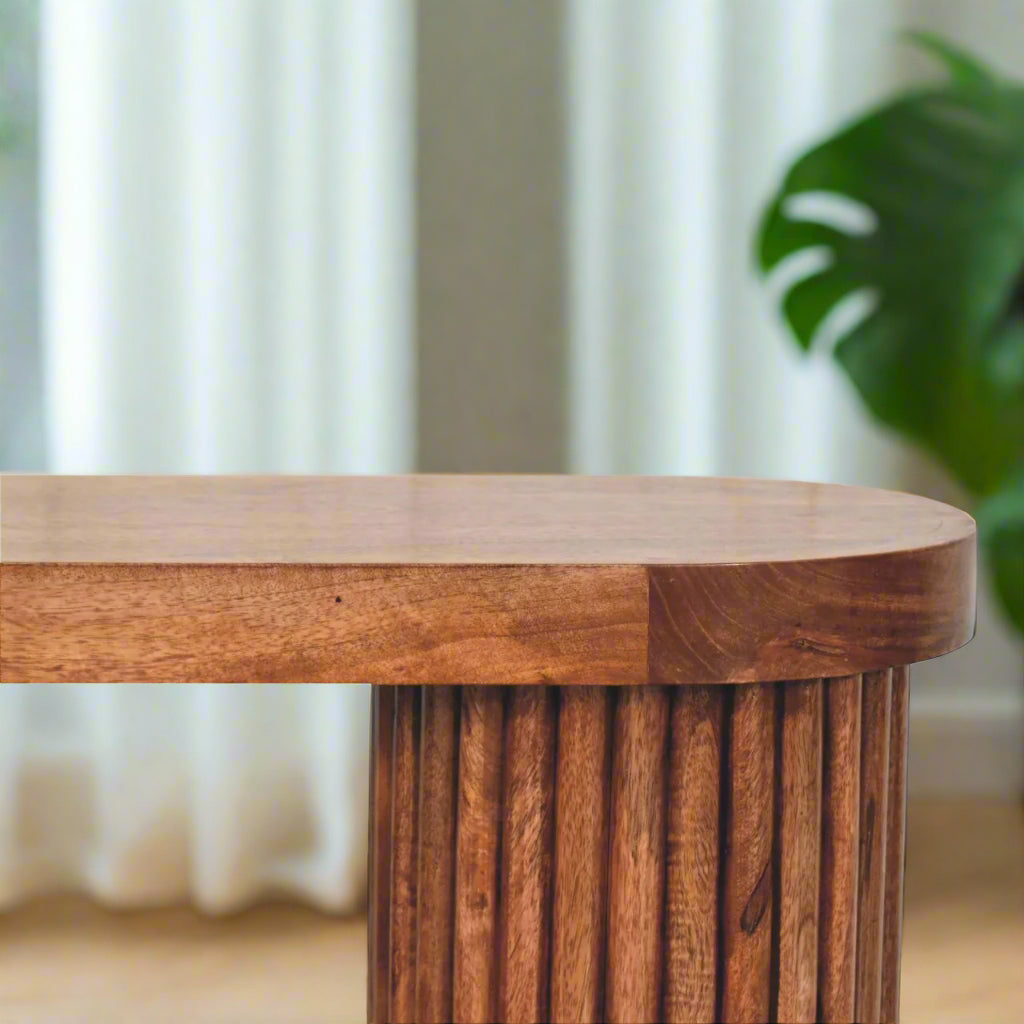 Eye level view of the Serenity Coffee Table's top, showcasing its white terrazzo surface and the ridged edges.