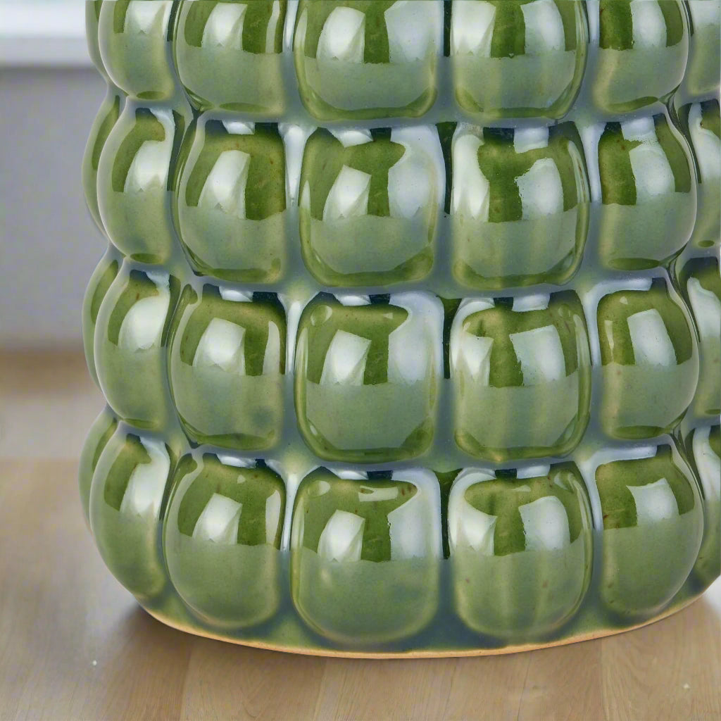Zoom-in view of the vase base highlighting the sturdy ceramic finish.