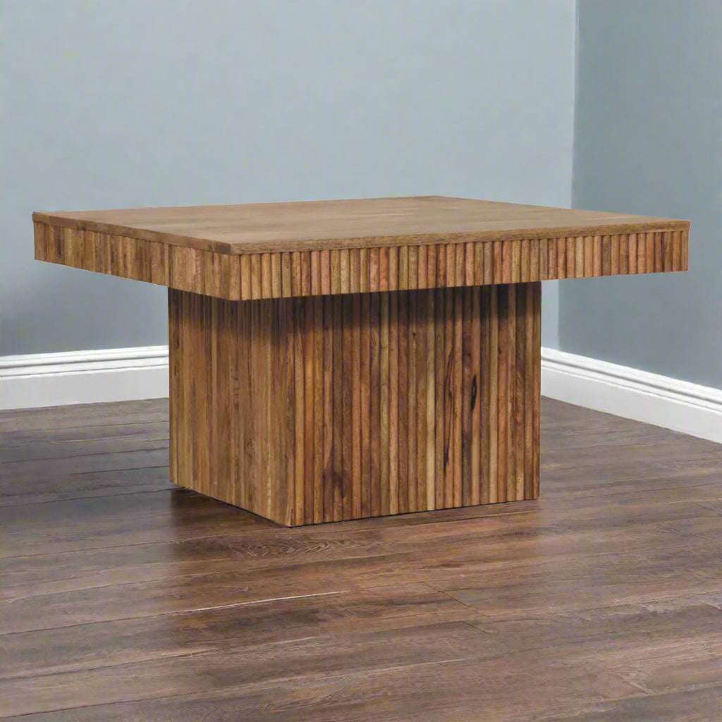 Angled view of the Soba Chunky Coffee Table on a wooden floor, showcasing its sturdy construction and oak-ish finish.
