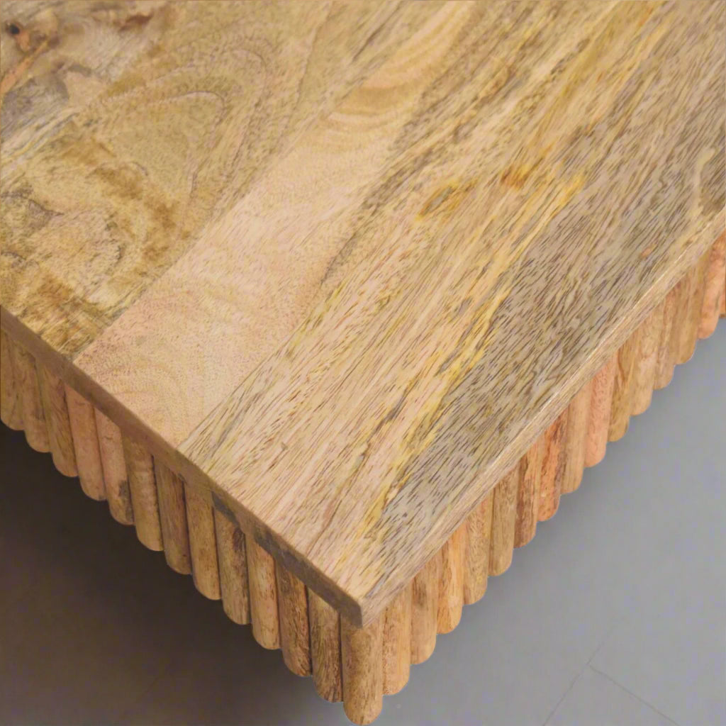 Top-down view focusing on the edge of the Soba Chunky Coffee Table, revealing the natural wooden grain on its top surface.