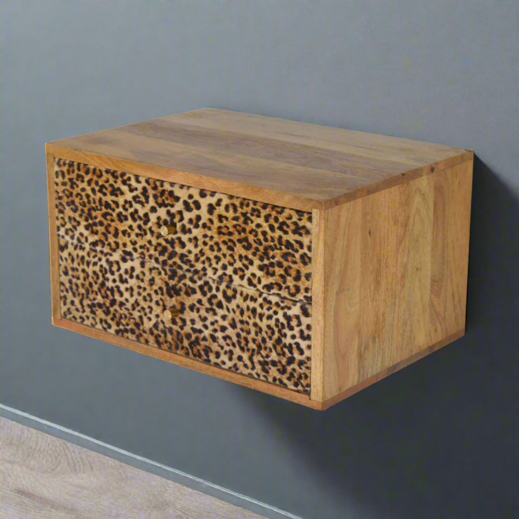 Elevated side view of the wall mounted leopard print drawer table, providing a comprehensive look at its structure from above.