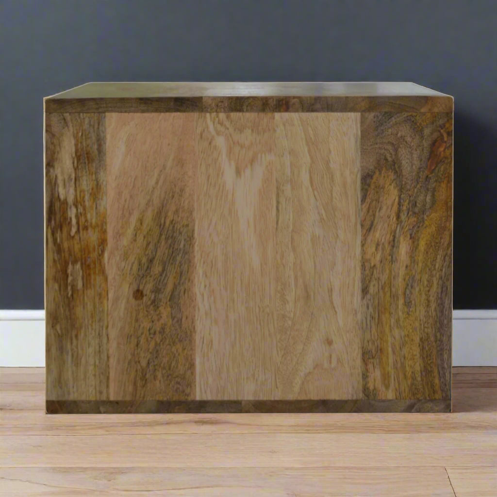 Side profile of the wall mounted leopard print drawer table positioned on a wooden surface, showing its design and finish.