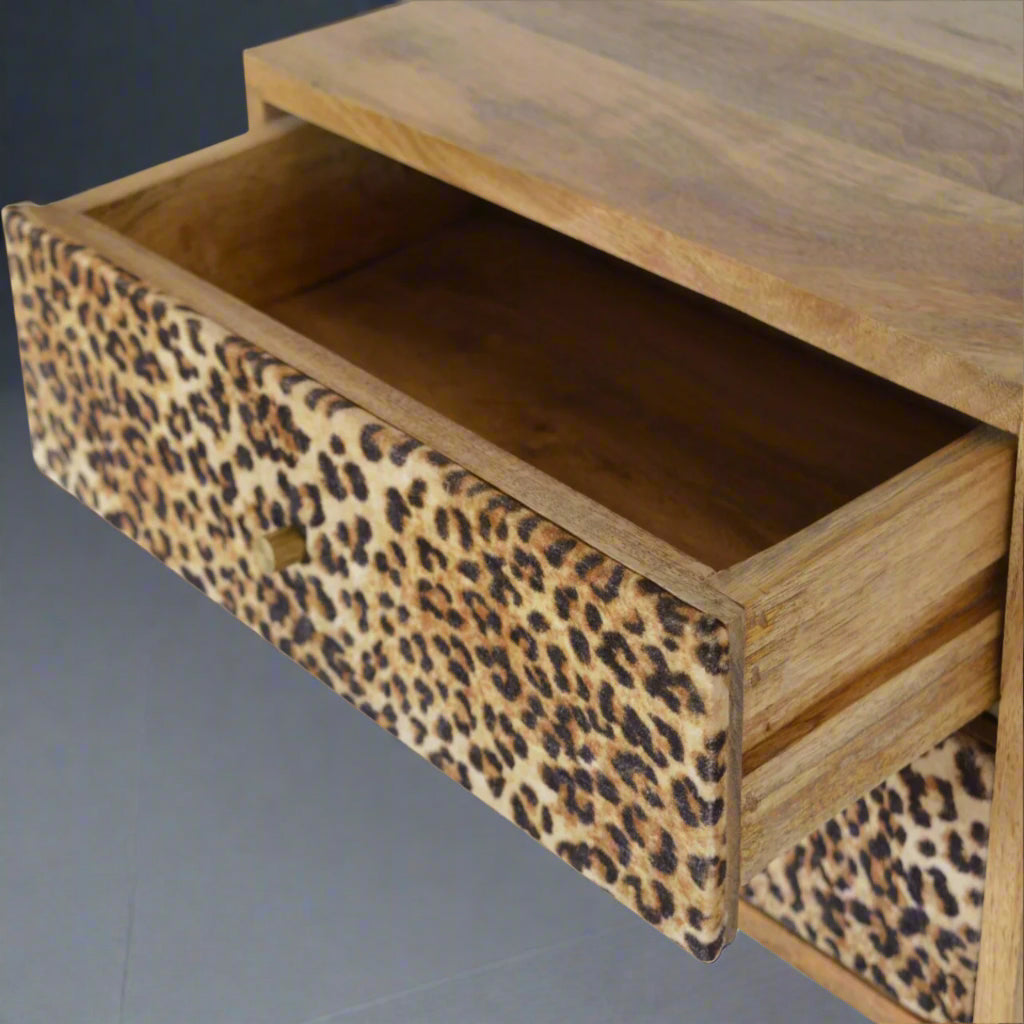 Top-down view of the wall mounted drawer table with the upper drawer pulled open, revealing its storage capacity.