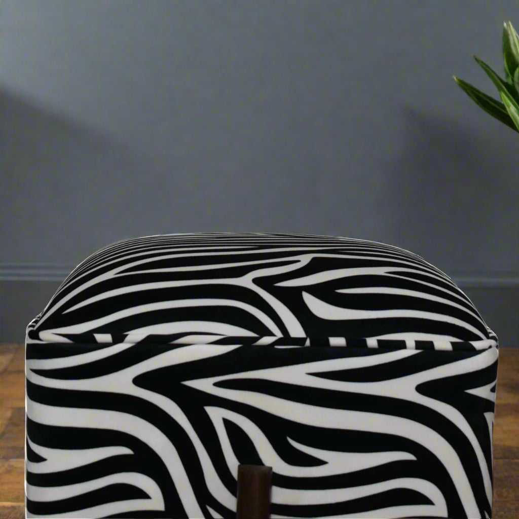 Close-up showing the texture of the cotton velvet zebra fabric on the footstool