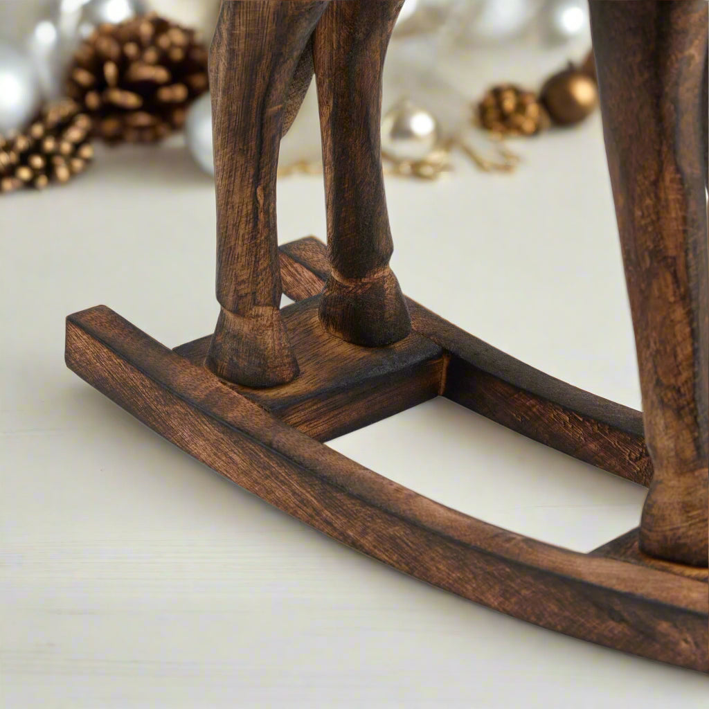 Close-up of the rocking bottom of a wooden rocking horse decor item add to Purple Flamingo UK cart today. 