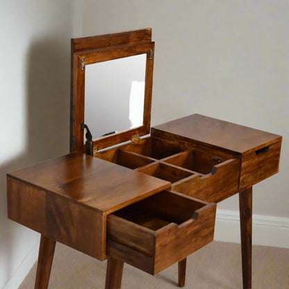Top‑down angled shot with mirror up, right drawer open, and internal compartments