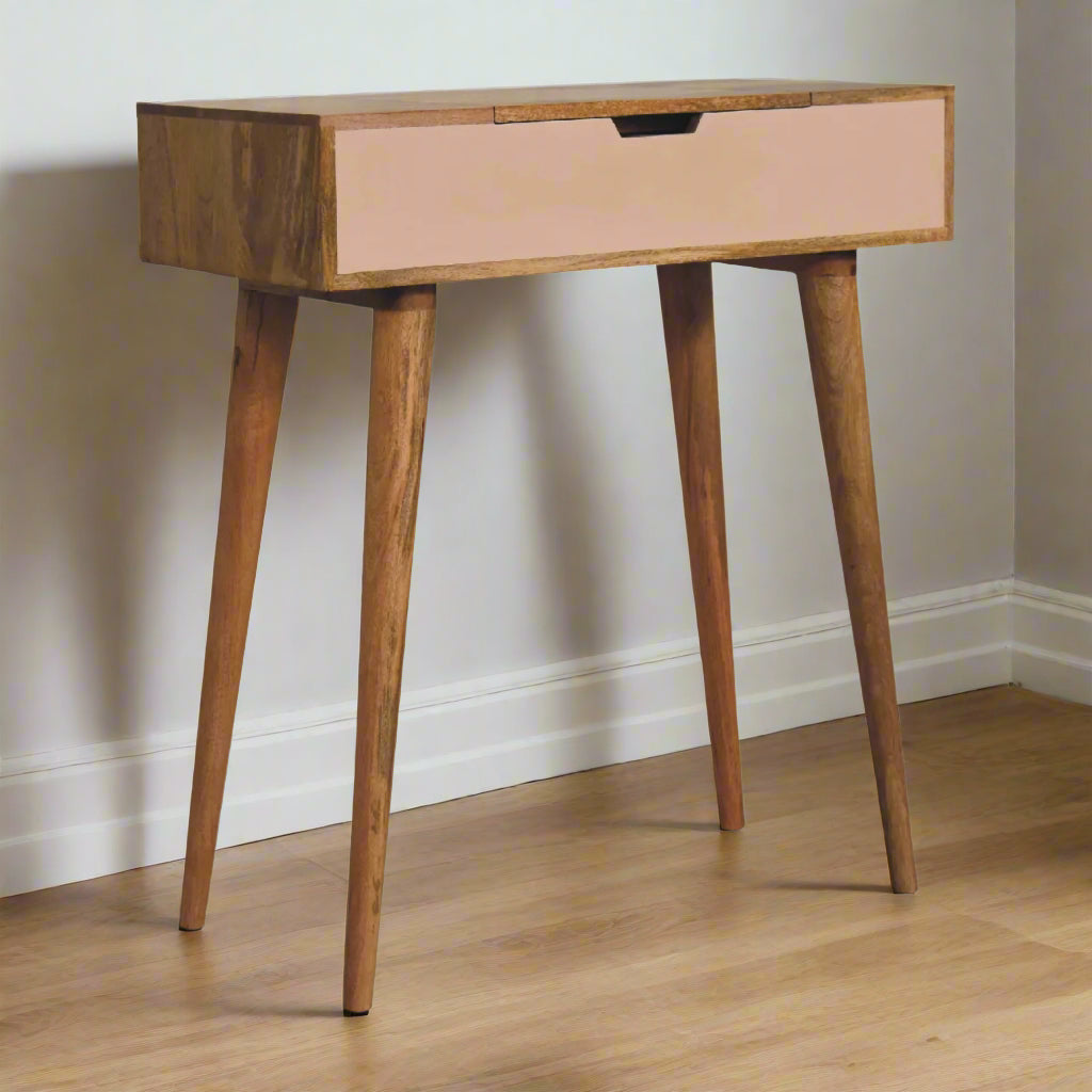 Front angled view of the cut-out hand painted mini dressing table, painted pink with oak-ish finish