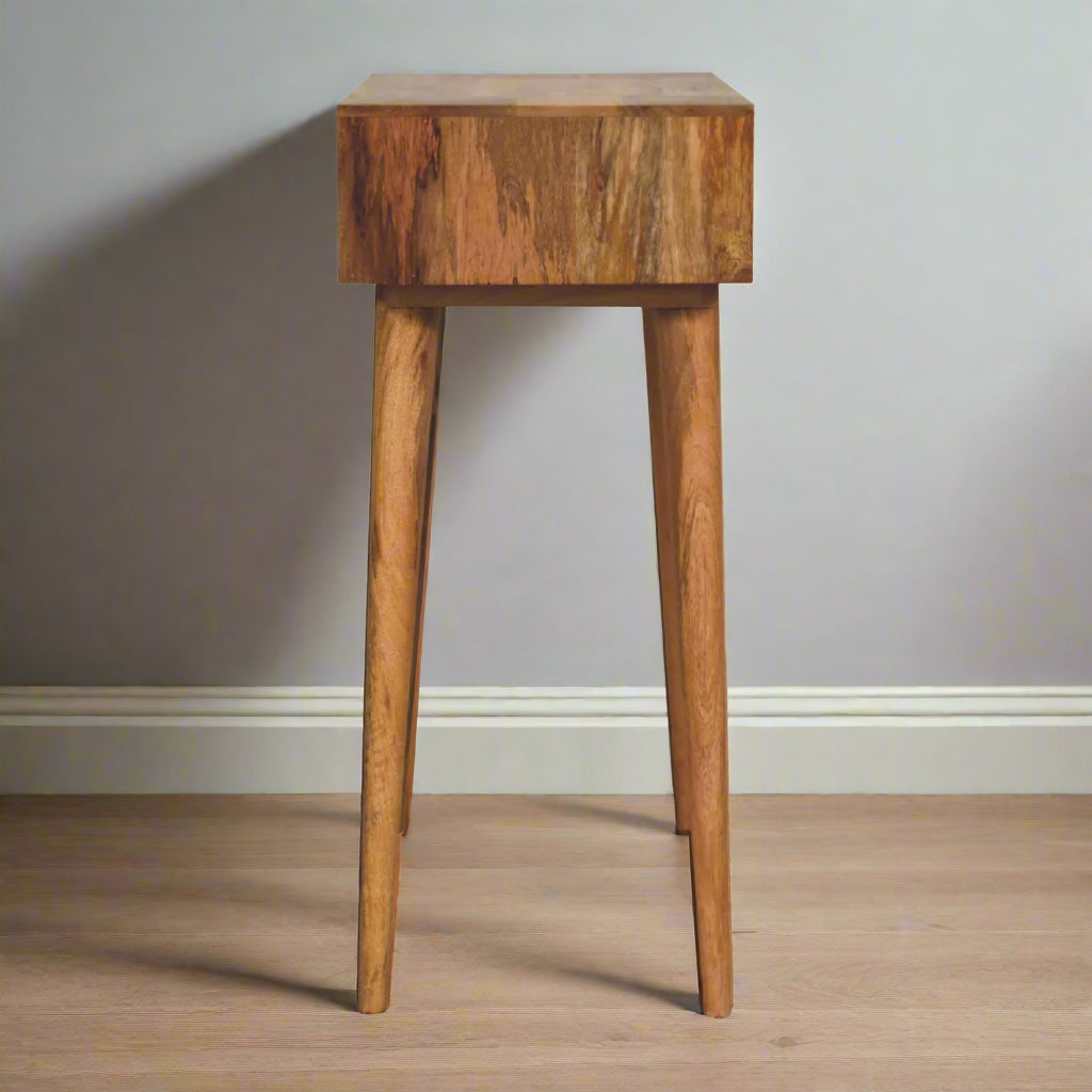Side view of the cut out hand painted mini dressing table, showcasing, pink paint and an oakish-finish