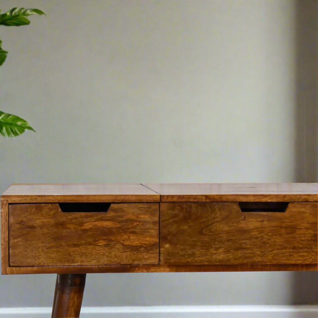 Close view of left side of cut-out natural dressing table, with chestnut finish, showcasing cut-out handles and closed drawer.