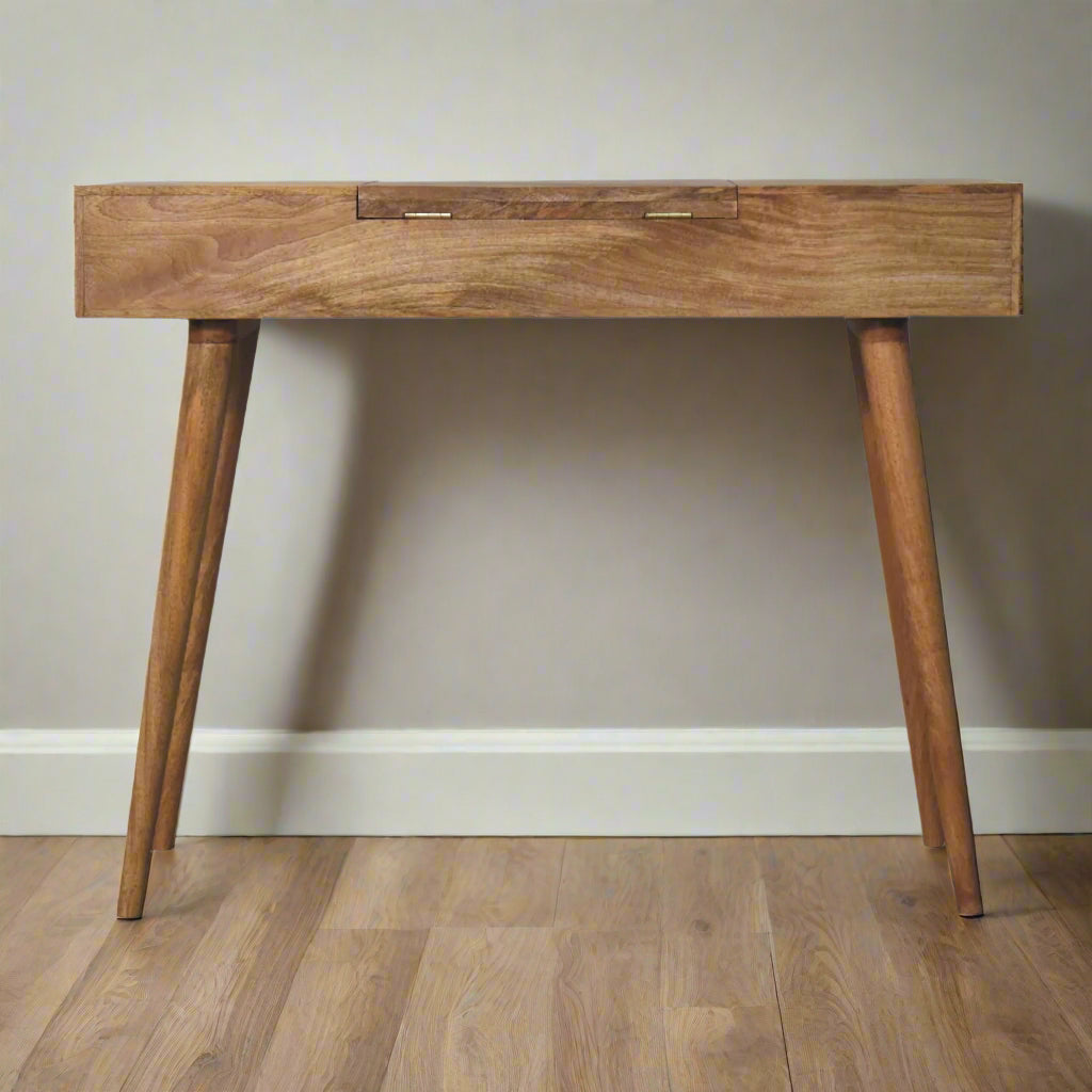 Back view of the cut-out natural dressing table, with oak-ish finish, highlighting  discreet fold-up hinges