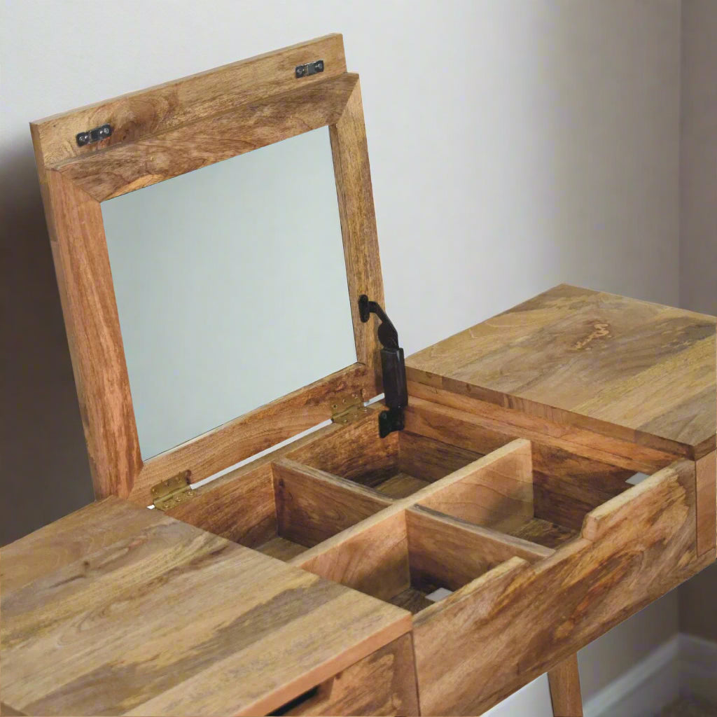 Close angle view of the cut-out natural dressing table, with oak-ish finish, showcasing the fold-up mirror open, revealing storage compartments.