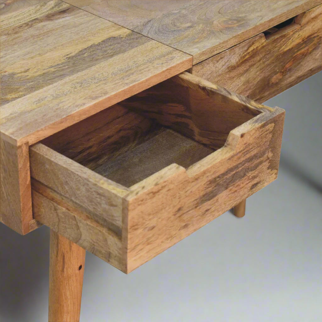 Cut-out natural dressing table, with oak-ish finish, showing close up of left drawer open.