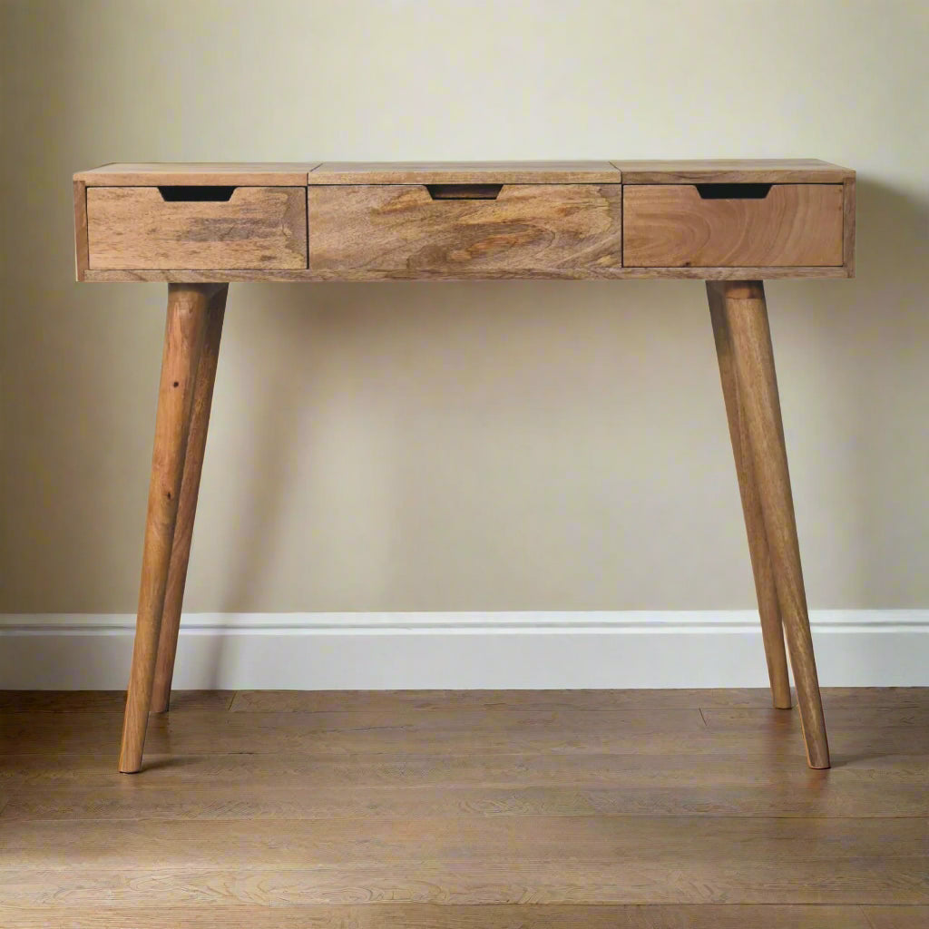 Front view of the cut-out natural dressing table, displaying nordic style legs.