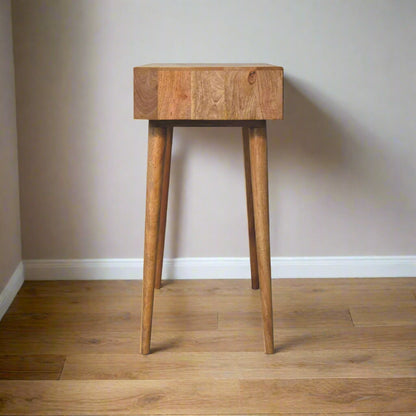 Side view of the cut-out natural dressing table, with oak-ish finish