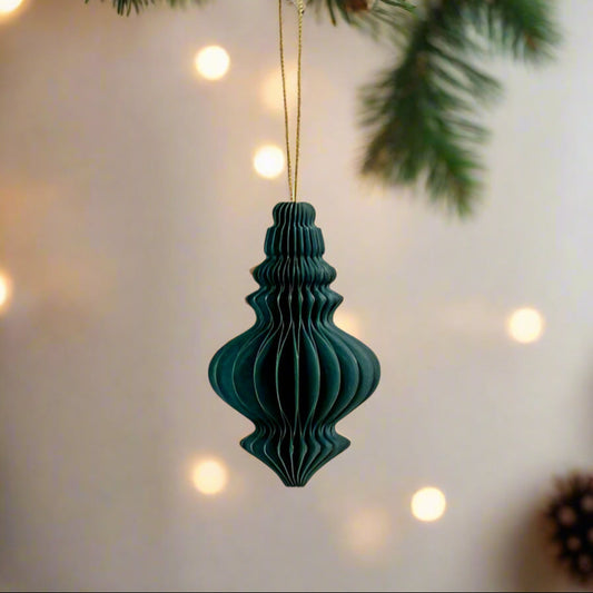 A nod to past christmases, a deep green paper chandelier shaped 10cm hanging decoration, folds flat and secures with magnets. buy at Purple Flamingo UK.
