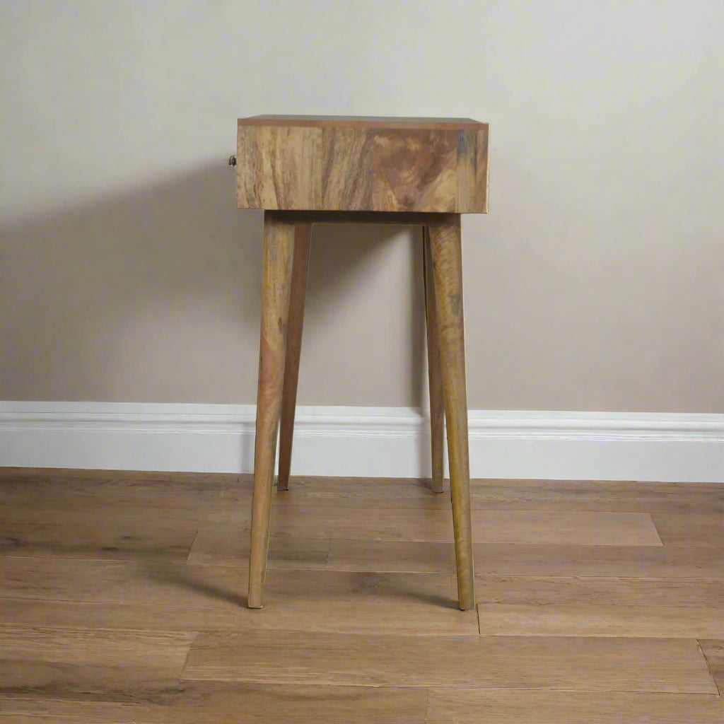Side view of the lined carved dressing table, displaying nordic style legs