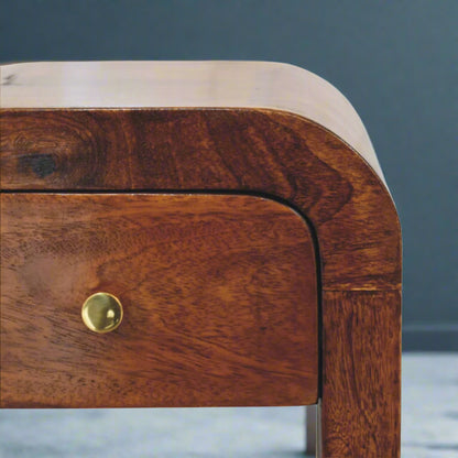 Close-up of the Mini Darcy Chestnut Bedside Table's single drawer with an elegant brass knob.