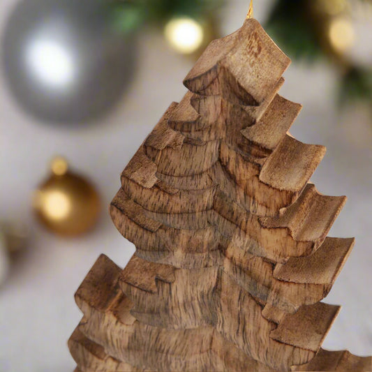 Close up view of top of wooden free standing Christmas tree ornament showcasing the intricately carved tree branches. Shop at Purple Flamingo UK