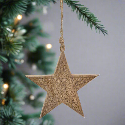 Wooden star hanging decoration displaying reverse face with intricately cut pattern, buy at Purple Flamingo UK