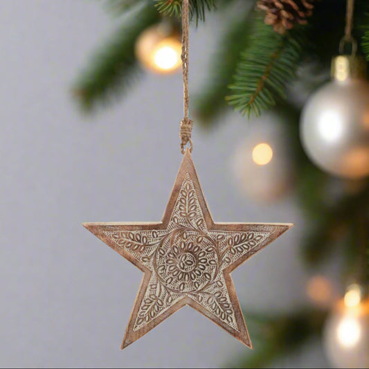 Wooden star hanging decoration displaying back view of intricately cut pattern and hanging twine, buy at Purple Flamingo UK