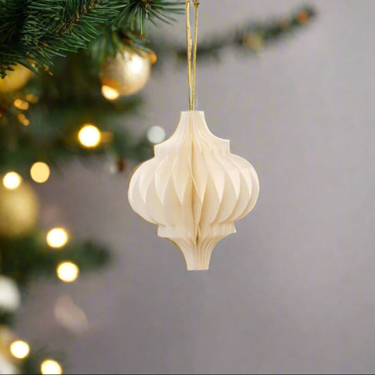 A dreamy off white paper hanging decoration shaped like a child's spinning top. Folds open and close with ease securing with magnets. Shop today at Purple Flamingo UK