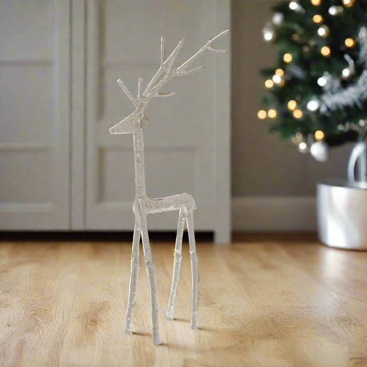 Medium sized enchanting stag free-standing ornament, sculpted from metal, standing proud in a festive setting. Shop now at Purple Flamingo UK.
