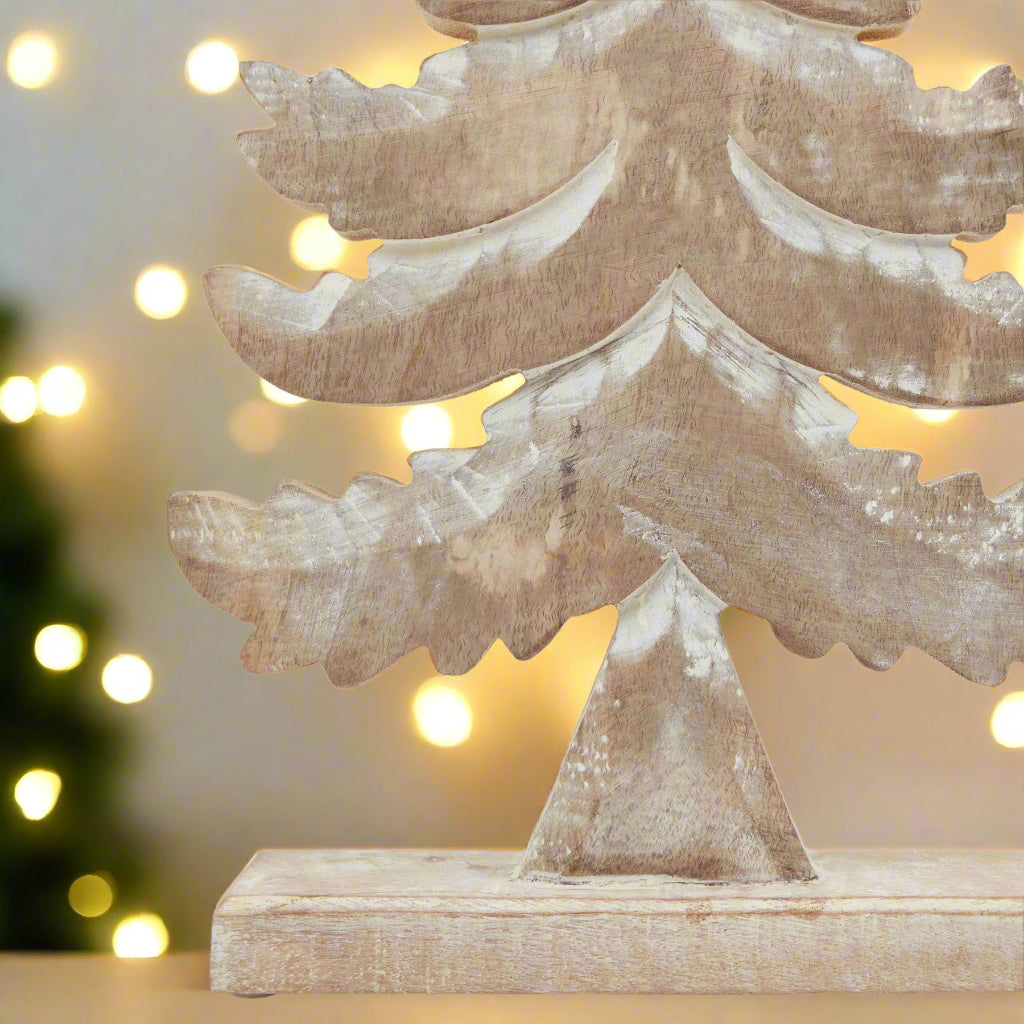 Wooden Christmas Tree design decoration ,close up view showing the white wash snowy effect and the tiered detail.