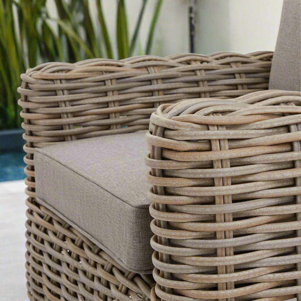 Angled view of a single seater from the Amalfi 5-Seater Set, with a focus on the left armrest showing the wicker weave.