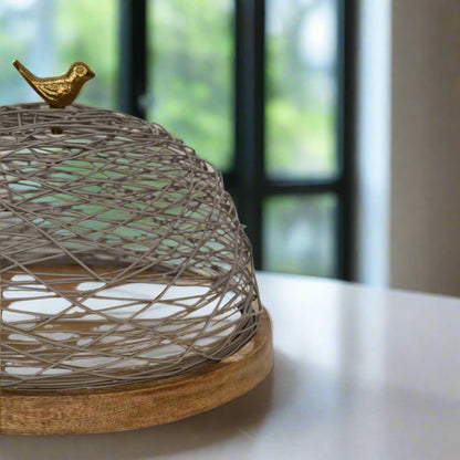 Angled side view of the Blue Bird Nest Cake Stand showcasing its handcrafted design and elegant silhouette